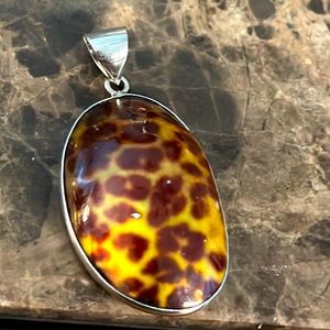 Animal print shell pendant mother of pearl base silver tone bale for hanging